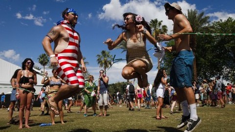 A group of friends jump rope on the first day of the Coachella Music and Arts Festival in Indio, Calif., on Friday, April 11, 2014. (Bethany Mollenkof/Los Angeles Times/MCT)