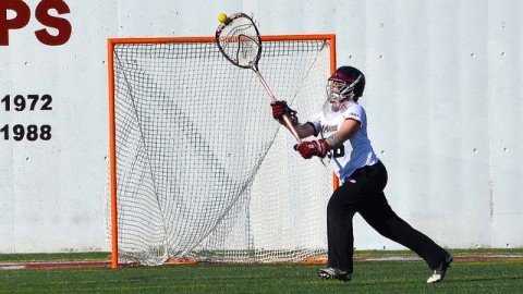 Massachusetts womens lacrosse goalie Rachel Vallarelli makes an impressive save. (Nicole Evangelista/Daily Collegian)