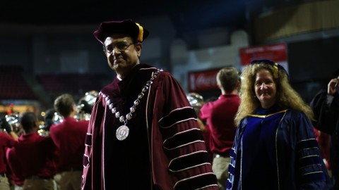 Chancellor Kumble Subbaswamy enters the Mullins Center at the beginning of New Student Convocation for the Class of 2019.