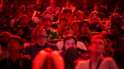 Spectators watch teams play Dota 2, a 5-on-5 video game, at KeyArena in Seattle on Thursday, Aug. 6, 2015. (Bettina Hansen/Seattle Times/TNS)