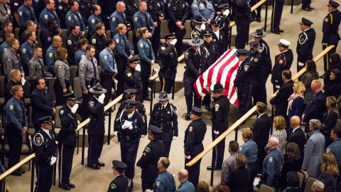(The Colorado Springs Police Honor Guard carries in the casket of Garrett Swasey, the 44-year-old University of Colorado at Colorado Springs police officer and six-year veteran of the department, during the funeral service at New Life Church on Friday, Dec. 4, 2015, in Colorado Springs, Colo. Swasey was killed Nov. 27 after responding to a shooting at a Colorado Springs Planned Parenthood, which left two others dead and 12 injured. Stacie Scott/Colorado Springs Gazette/TNS)