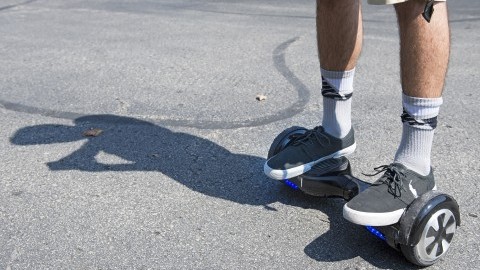 Logan Meis, 20, balances on his hover board outside his apartment complex in Overland Park, Kan., on Friday, Sept. 4, 2015. Meis purchased the personal transportation device for about $330 online. (Tammy Ljungblad/Kansas City Star/TNS)