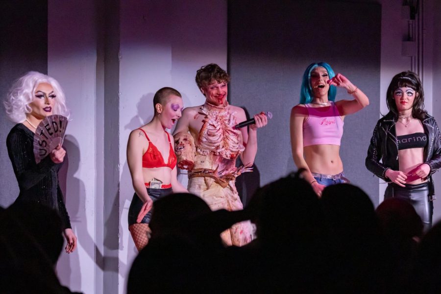 Contestants of the WMUA Drag Show line up on stage