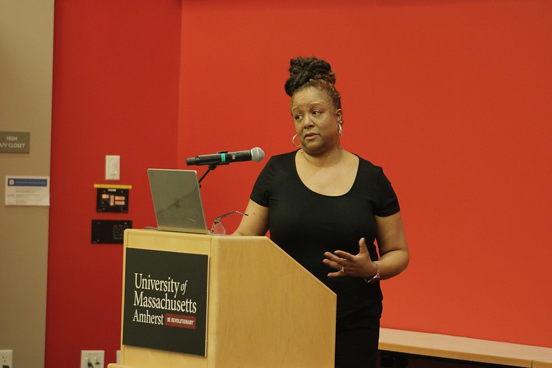 Lucinda Canty introduces the speakers of the night at the Black Maternal Health Symposium. 