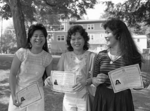 Chamnan Koy Tan, Sveth Leng Bao, and Sopath Un hold their certificates of U.S citizenship. 

Photo by Jim Gipe, Daily Hampshire Gazette 1988