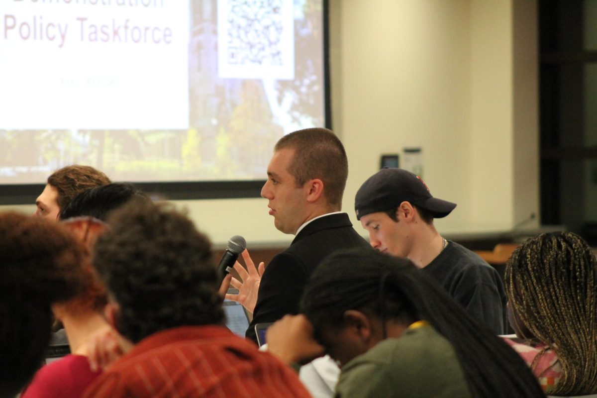 Colin Humphries, President of SGA, asks a question regarding the use of masks in protests.

