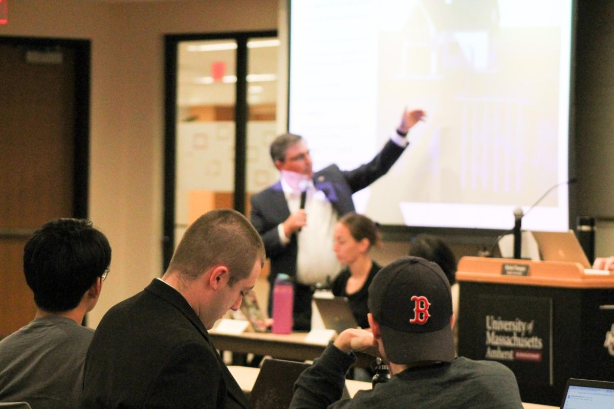 Tilman Wolf gives a presentation regarding the carbon footprint of UMass.