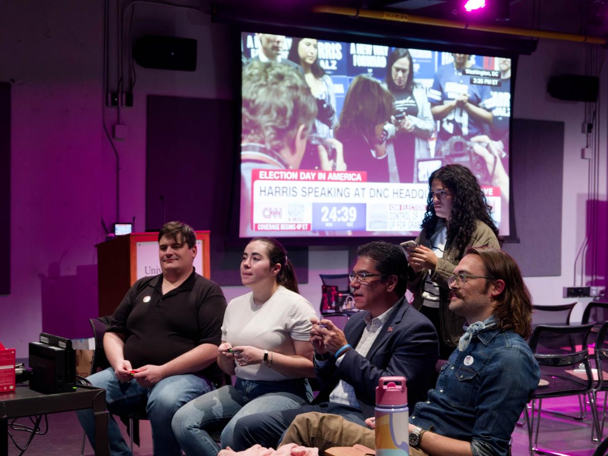 Chancellor Javier Reyes plays Mario Kart on the Nintendo Switch at the Election Day Drop-In event at the Black Box Theater at the Student Union on Election Day 11/5/24.